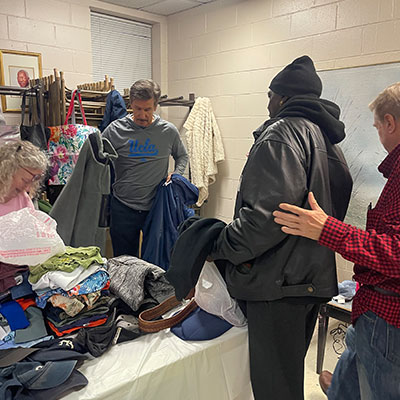 Distributing coats from Fall Coat Drive to Charleston homeless, December 2025